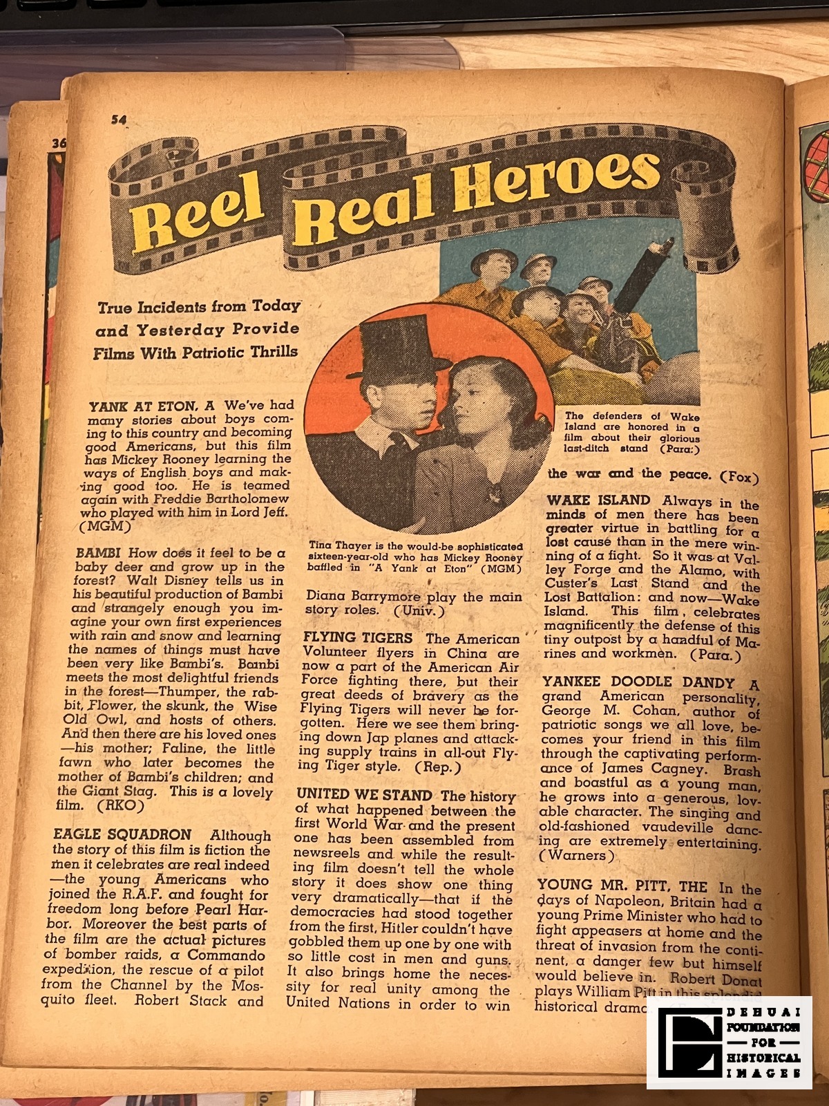 TFA-CA-127 — The leaf bearing the folio 54: the film column “Reel Real Heroes”, with the notice of Republic’s Flying Tigers in the centre column. A facing leaf across the gutter, and a separate leaf numbered 36 lying beneath the copy, show at the edges of the frame.