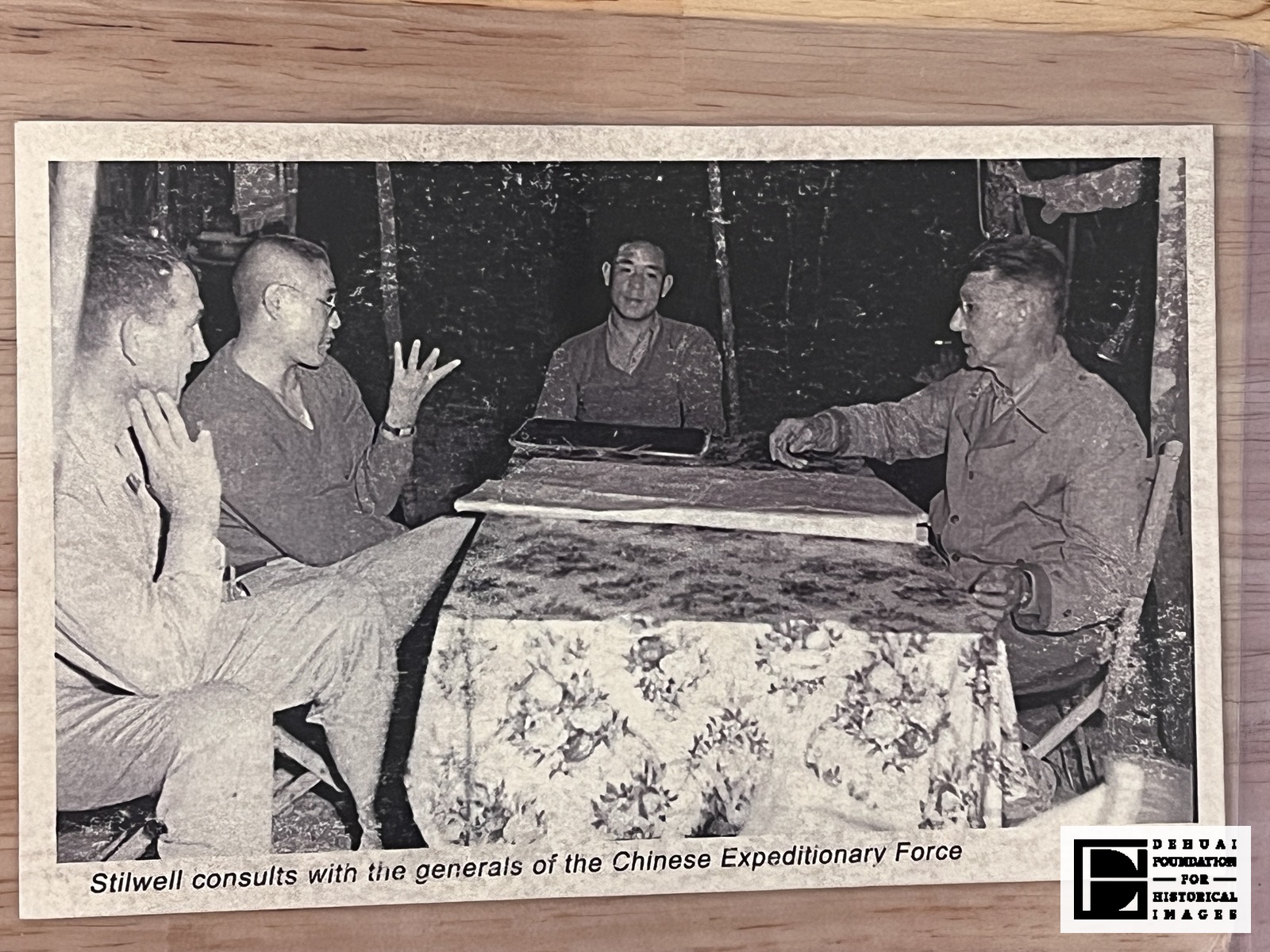 TFA-CA-128 — Recto: the reproduced photograph and its single printed caption line, "Stilwell consults with the generals of the Chinese Expeditionary Force".